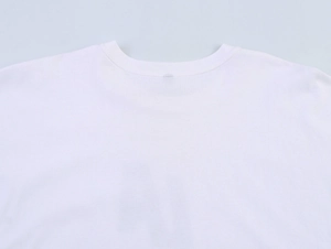 Close-up of the round neckline and stitching on a white cotton T-shirt