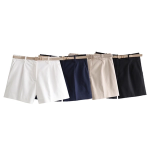 Flat lay of women's high-waisted shorts with matching belts in four classic colors