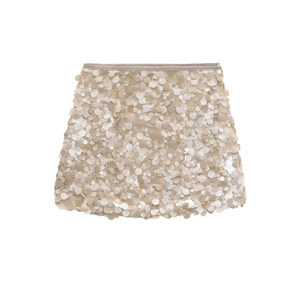 Elegant champagne beige mini skirt featuring all-over circular sequins on a white background
