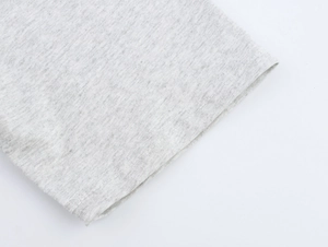 Detail of grey marl t-shirt showing high-quality double-needle stitching on the sleeve cuff