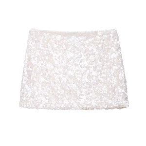 Close-up of white sequin embroidery detail on a high-waist A-line mini skirt