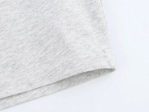 Detail of twin-needle coverstitch on heather grey cotton knit fabric hemline
