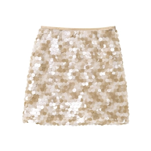 Close-up detail of champagne gold sequin mini skirt featuring side zipper closure and shimmer