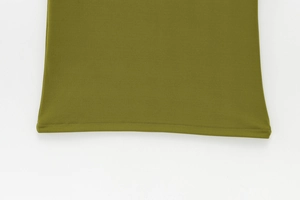Detailed view of the olive green sleeveless dress hem with fine flat-stitch craftsmanship
