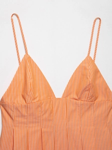 Detail of orange and white vertical striped poplin camisole with pleated waist and V-neck