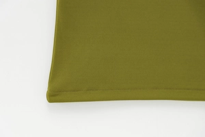 Close-up detail of the precise stitching and olive green fabric texture on this summer dress