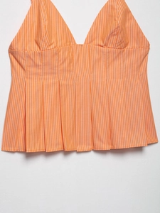 Detailed view of the orange and white striped poplin camisole with pleated waist design