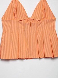 Detail of orange striped top showing back invisible zipper and adjustable straps
