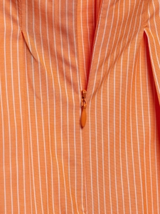 Close-up of high-quality invisible zipper on orange and white striped poplin camisole