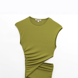Olive green sleeveless summer dress with ruched side and cutout detail on white background
