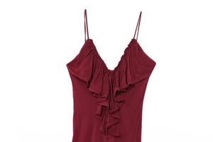 Close-up of deep red summer dress featuring delicate ruffles and thin shoulder straps