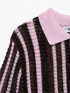 Detail of pink and brown vertical striped knit Polo shirt with openwork mesh texture