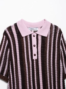 Detail of pink and brown striped knit polo shirt with breathable mesh texture and collar