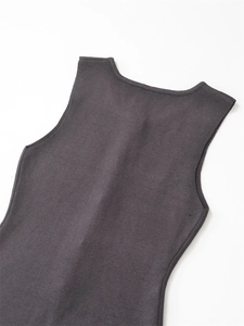 Detail of dark grey knitted vest featuring a soft rib knit texture and elegant wide U-neck