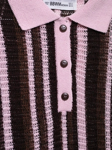Detail of pink and brown striped knit polo collar with three brown buttons and mesh texture