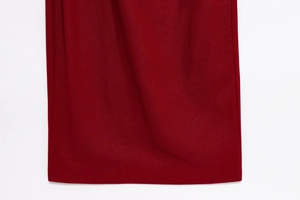 Macro detail of wine red sleeveless dress fabric showing smooth texture and high quality hem