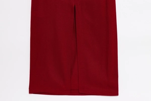 Detailed macro view of the side slit design on a dark red sleeveless summer dress