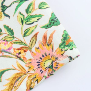 Close-up of lightweight summer dress fabric featuring delicate floral prints and texture