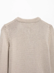Close-up of the ribbed crew neckline and high-quality knit texture of this beige cardigan