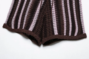 Close-up of brown and pink vertical striped knit fabric with detailed mesh texture