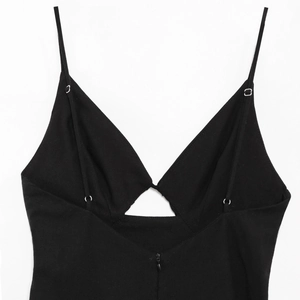 Detail of black V-neck camisole dress with thin straps and back invisible zipper closure