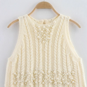 Chic knit vest with faux pearls and cable knit pattern in elegant cream white color