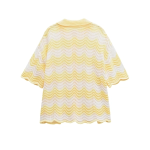 Close-up of yellow and white wave striped knit texture and hollow out collar details