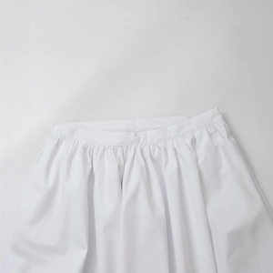 Women's high waist white pleated skirt featuring fine smocked waist and lightweight fabric