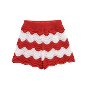 Detail of red and white wave striped knit shorts with delicate hollow-out crochet pattern