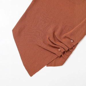 Knit short sleeve T-shirt with vertical texture and decorative side buttons in rust red