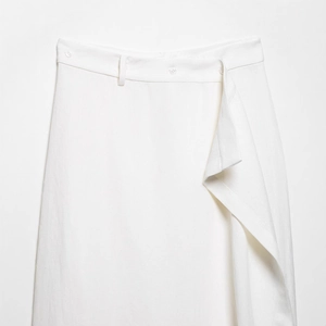 Elegant white asymmetrical wrap midi skirt with button detail and textured fabric