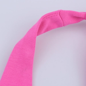 Macro view of rose pink knitted fabric texture and neat side stitching detail