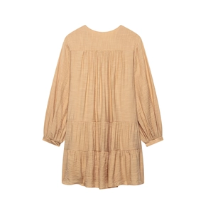 Women's light orange long sleeve tiered mini dress with textured crinkle fabric
