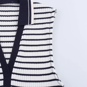 Detail of the striped rib knit texture and Polo collar of this summer sleeveless top
