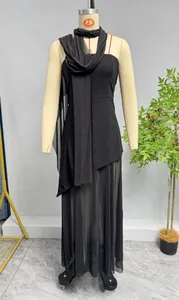 Elegant black sleeveless bodycon dress set featuring mesh halter neck and sheer hem details