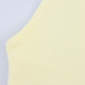 Detail of soft pale yellow knit fabric with fine stitching texture and armhole design