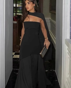 Detail view of a black strapless evening dress with an asymmetric shoulder wrap