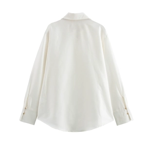 Detail view of white satin shirt back with curved hem and gold buttons on cuffs