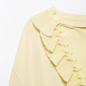 Women's light yellow V-neck blouse featuring ruffled lace trim and crinkle fabric texture