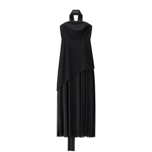 Detail of black halter dress featuring mesh patchwork and asymmetrical pleated hem
