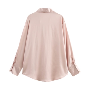 Detail of pink satin shirt back view showing smooth fabric texture and buttoned cuffs