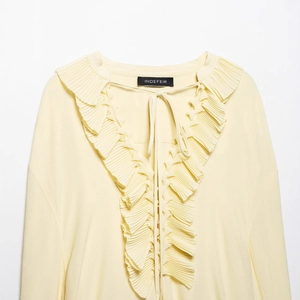 Women's light yellow V-neck blouse with ruffled lace trim and elegant neck tie
