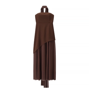 Detail of dark brown halter neck dress with asymmetric mesh stitching and pleated hemline
