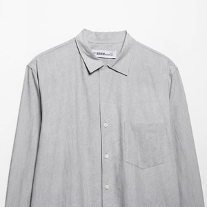Minimalist grey cotton linen shirt with front pocket and button detail for women