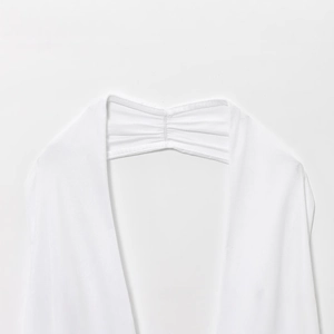 Minimalist backless white halter dress featuring elastic pleated back straps detail
