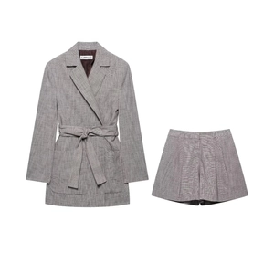 Detail of fine grid pattern texture on grey commuter blazer and shorts suit set