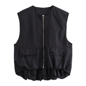 Detailed view of women's black loose vest featuring large flap pockets and silver front zipper