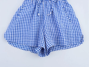Detail of blue and white gingham casual shorts with elastic drawstring waist and pockets