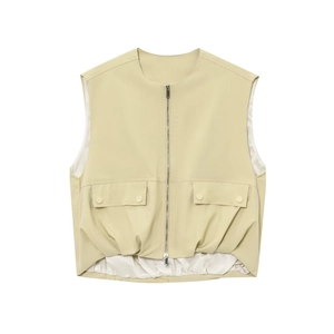 Detailed close-up of light beige faux leather vest with metal zipper and pocket detail
