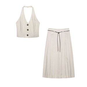Close-up of linen blend vest and skirt set showing fabric texture and button details